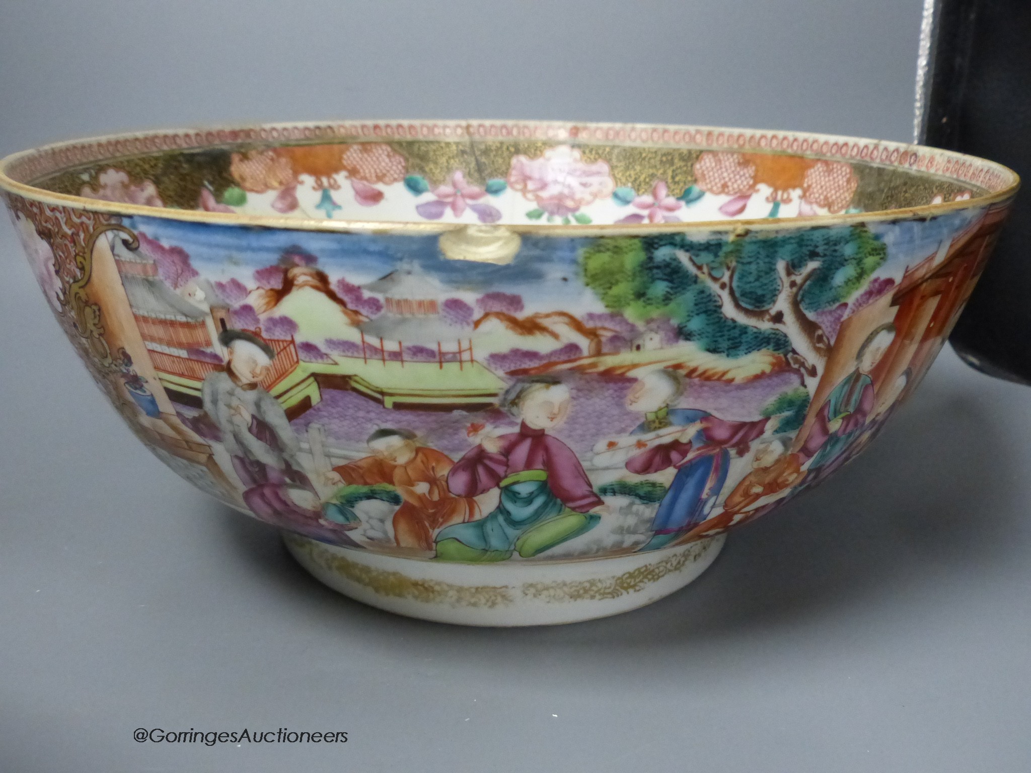 An 18th century Chinese Export famille rose punch bowl and another similar bowl (a.f.), largest 32cm diameter